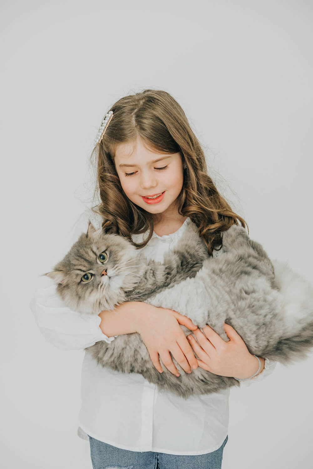 Girl holding her cat